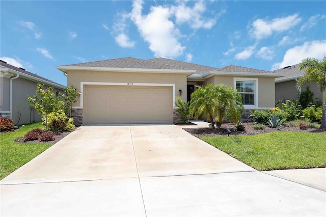 12357 Nantahala Run, Parrish, FL 34219 - view of front of house featuring stucco siding, an attached garage, and concrete driveway