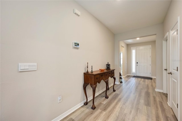 12357 Nantahala Run, Parrish, FL 34219 - entrance foyer with light wood-style floors and baseboards