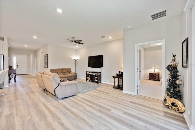 12357 Nantahala Run, Parrish, FL 34219 - living room featuring light wood finished floors, a ceiling fan, and recessed lighting