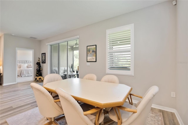 12357 Nantahala Run, Parrish, FL 34219 - dining room with light wood-type flooring and baseboards