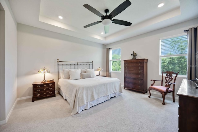 12357 Nantahala Run, Parrish, FL 34219 - carpeted bedroom featuring a tray ceiling, recessed lighting, and a ceiling fan