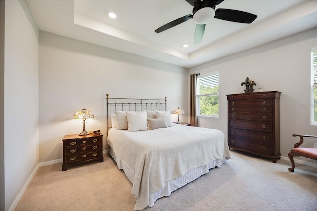 12357 Nantahala Run, Parrish, FL 34219 - bedroom featuring light carpet, recessed lighting, a raised ceiling, and ceiling fan