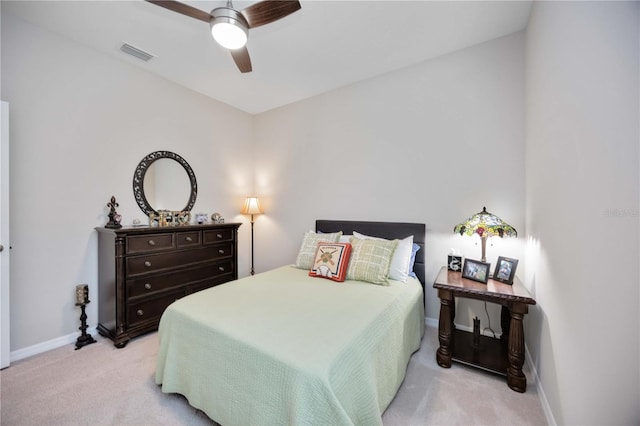 12357 Nantahala Run, Parrish, FL 34219 - bedroom with light colored carpet and a ceiling fan