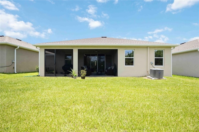 12357 Nantahala Run, Parrish, FL 34219 - back of property featuring a yard, a sunroom, and stucco siding