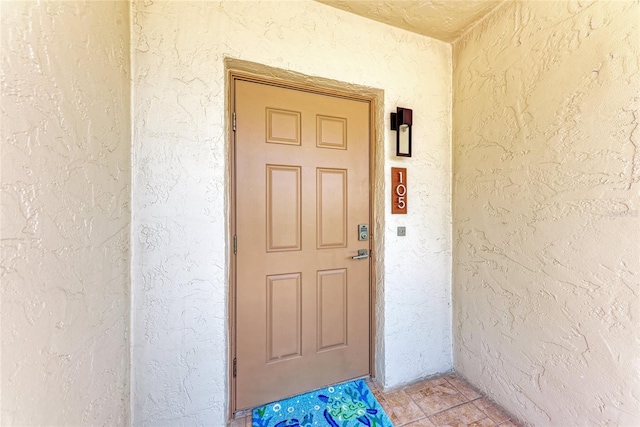 4805 Gulf Of Mexico Dr Unit 105, Longboat Key, FL 34228 - doorway to property with stucco siding