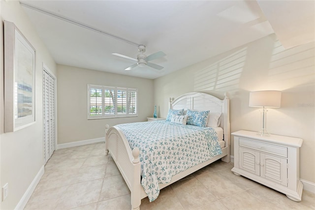4805 Gulf Of Mexico Dr Unit 105, Longboat Key, FL 34228 - bedroom featuring light tile patterned floors and a ceiling fan
