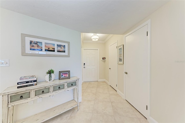 4805 Gulf Of Mexico Dr Unit 105, Longboat Key, FL 34228 - hall featuring light tile patterned floors and ornamental molding
