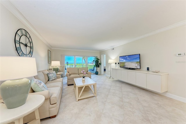 4805 Gulf Of Mexico Dr Unit 105, Longboat Key, FL 34228 - living area featuring ornamental molding and light tile patterned flooring