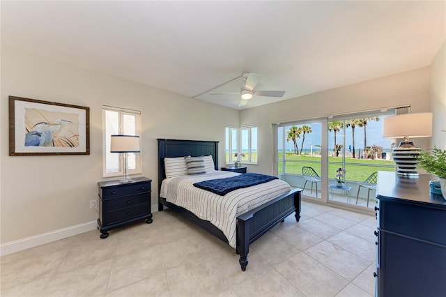 4805 Gulf Of Mexico Dr Unit 105, Longboat Key, FL 34228 - bedroom with access to outside, light tile patterned floors, and a ceiling fan