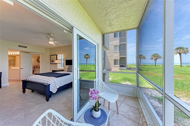4805 Gulf Of Mexico Dr Unit 105, Longboat Key, FL 34228 - sunroom with plenty of natural light and a ceiling fan