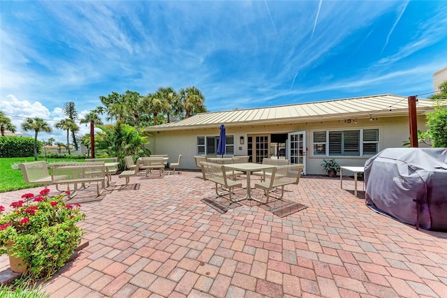 4805 Gulf Of Mexico Dr Unit 105, Longboat Key, FL 34228 - view of patio with outdoor dining area and area for grilling