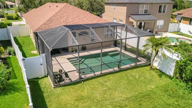 14255 Gnatcatcher Ter, Lakewood Ranch, FL 34202 - view of swimming pool with a fenced backyard, a patio, and glass enclosure