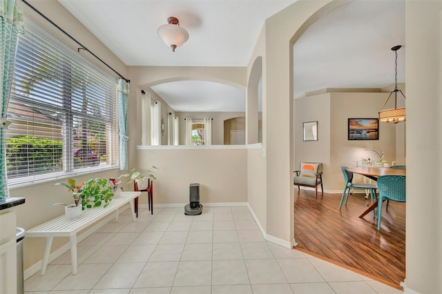 14255 Gnatcatcher Ter, Lakewood Ranch, FL 34202 - corridor featuring arched walkways and light tile patterned floors