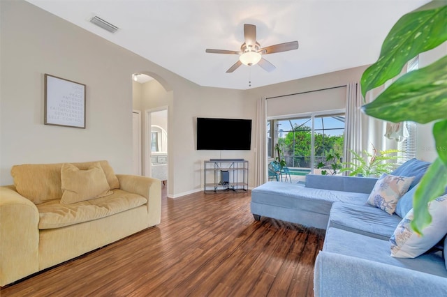 14255 Gnatcatcher Ter, Lakewood Ranch, FL 34202 - living area with wood finished floors, arched walkways, and ceiling fan