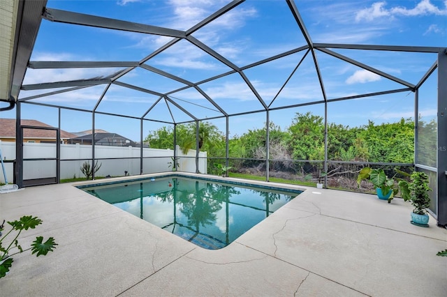 14255 Gnatcatcher Ter, Lakewood Ranch, FL 34202 - view of swimming pool with a patio area, a fenced backyard, and glass enclosure