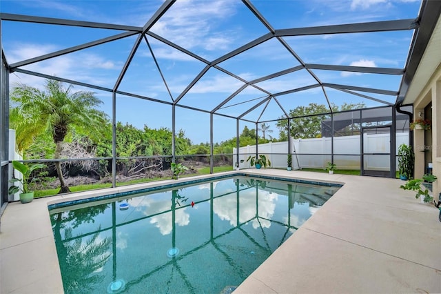 14255 Gnatcatcher Ter, Lakewood Ranch, FL 34202 - outdoor pool with a patio area and glass enclosure
