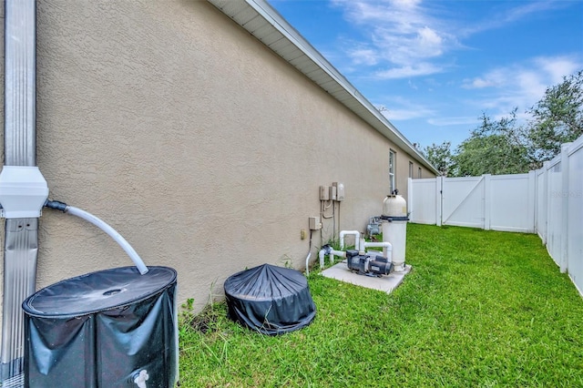 14255 Gnatcatcher Ter, Lakewood Ranch, FL 34202 - fenced backyard featuring a gate and a patio area