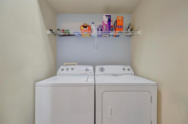 14255 Gnatcatcher Ter, Lakewood Ranch, FL 34202 - laundry area featuring washing machine and clothes dryer