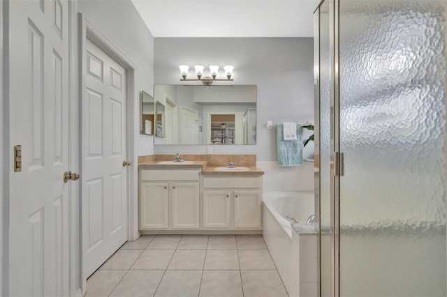 14255 Gnatcatcher Ter, Lakewood Ranch, FL 34202 - full bathroom with tile patterned floors, vanity, a stall shower, and a bath