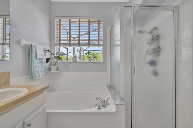 14255 Gnatcatcher Ter, Lakewood Ranch, FL 34202 - full bathroom featuring vanity, a shower stall, and a garden tub