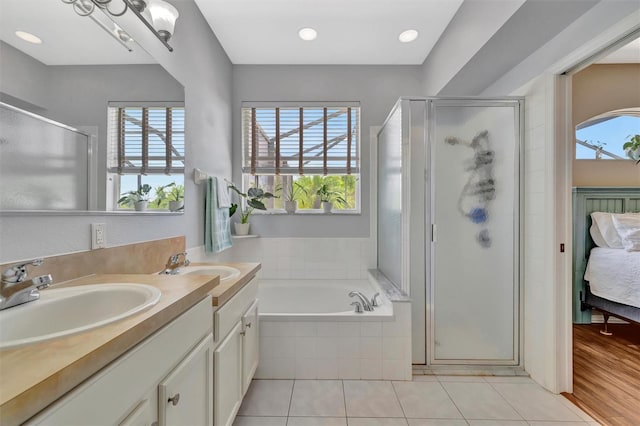 14255 Gnatcatcher Ter, Lakewood Ranch, FL 34202 - full bathroom with a shower stall, ensuite bathroom, double vanity, a bath, and recessed lighting