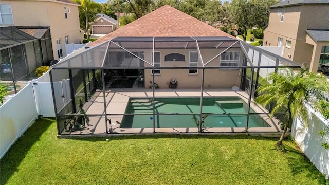 14255 Gnatcatcher Ter, Lakewood Ranch, FL 34202 - back of property with a fenced backyard, a lanai, roof with shingles, and a patio area