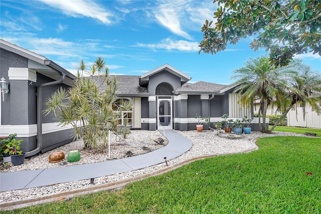 80 Rio Cuarto St, Punta Gorda, FL 33983 - ranch-style home with a front yard and stucco siding