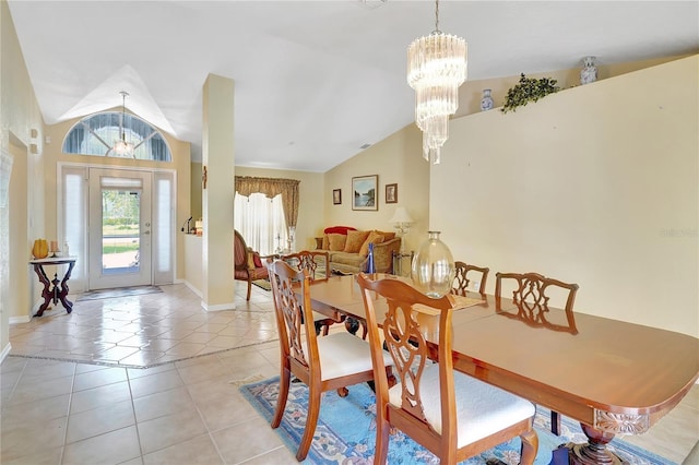 80 Rio Cuarto St, Punta Gorda, FL 33983 - dining space with vaulted ceiling, a chandelier, and light tile patterned flooring