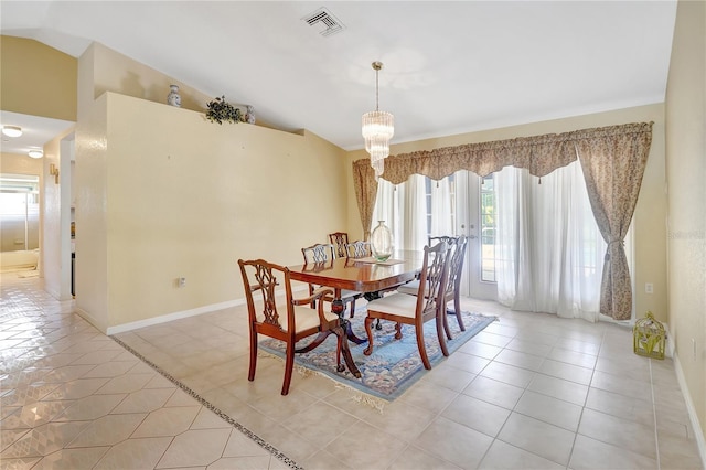 80 Rio Cuarto St, Punta Gorda, FL 33983 - dining space featuring plenty of natural light, lofted ceiling, a chandelier, and light tile patterned flooring
