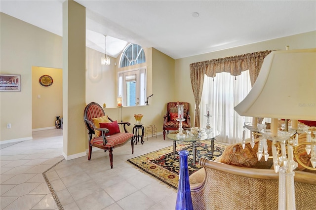 80 Rio Cuarto St, Punta Gorda, FL 33983 - sitting room featuring lofted ceiling, healthy amount of natural light, and light tile patterned flooring