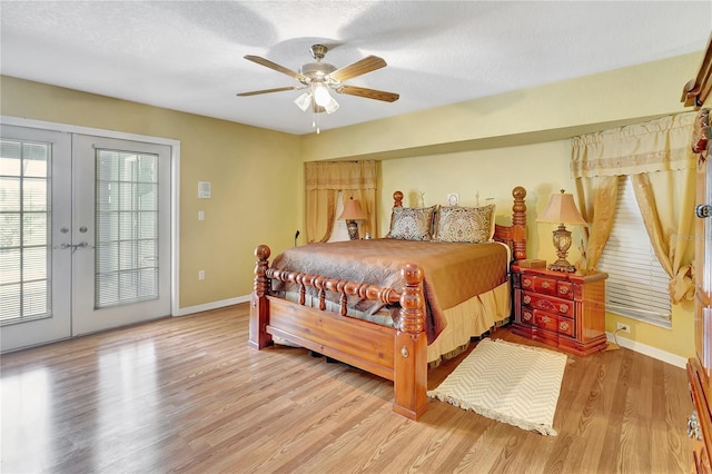 80 Rio Cuarto St, Punta Gorda, FL 33983 - bedroom featuring french doors, access to exterior, light wood-style flooring, a ceiling fan, and a textured ceiling