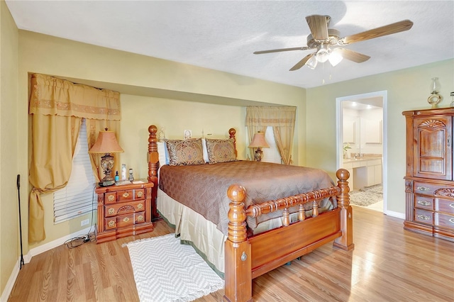 80 Rio Cuarto St, Punta Gorda, FL 33983 - bedroom with wood finished floors, ensuite bath, and a ceiling fan