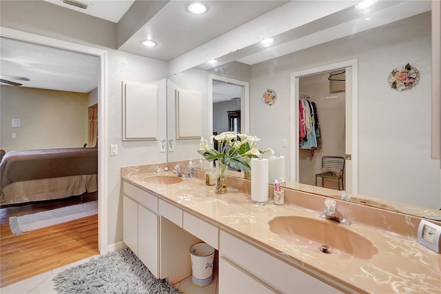 80 Rio Cuarto St, Punta Gorda, FL 33983 - full bathroom featuring double vanity, ensuite bathroom, recessed lighting, tile patterned flooring, and a spacious closet
