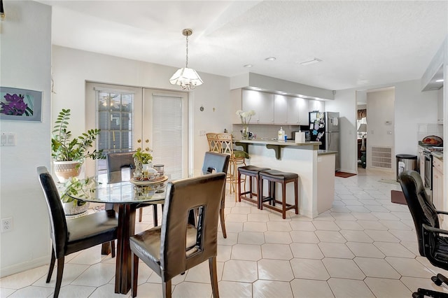 80 Rio Cuarto St, Punta Gorda, FL 33983 - dining space featuring a chandelier