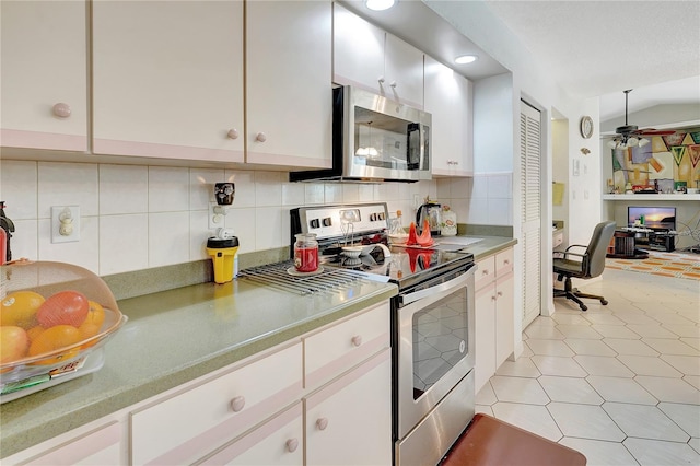 80 Rio Cuarto St, Punta Gorda, FL 33983 - kitchen featuring appliances with stainless steel finishes, decorative backsplash, white cabinets, a ceiling fan, and recessed lighting