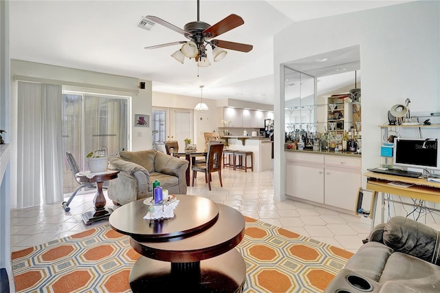 80 Rio Cuarto St, Punta Gorda, FL 33983 - living room with a ceiling fan, vaulted ceiling, and light tile patterned flooring