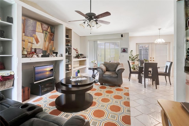 80 Rio Cuarto St, Punta Gorda, FL 33983 - living area with a ceiling fan, built in shelves, and tile patterned flooring