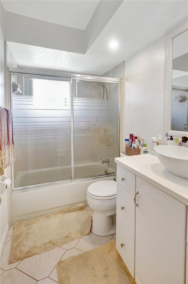 80 Rio Cuarto St, Punta Gorda, FL 33983 - bathroom with vanity, shower / bath combination with glass door, and tile patterned flooring