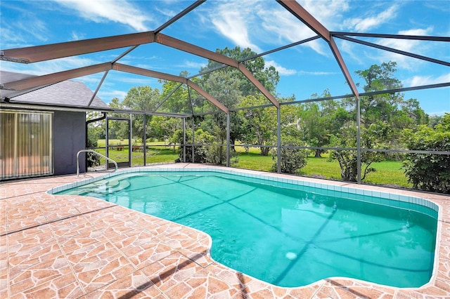 80 Rio Cuarto St, Punta Gorda, FL 33983 - outdoor pool with a patio area, view of wooded area, and a lanai
