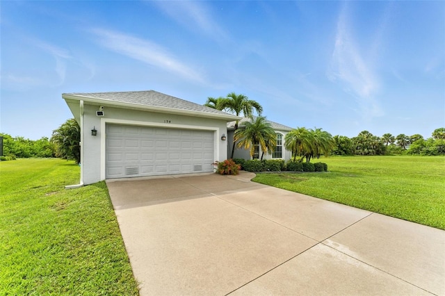 194 Sunset Rd, Rotonda West, FL 33947 - ranch-style home with concrete driveway, a garage, a front lawn, and stucco siding