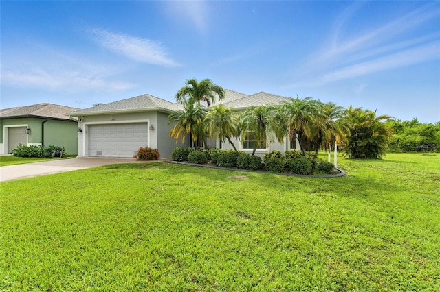 194 Sunset Rd, Rotonda West, FL 33947 - view of front of home with an attached garage, stucco siding, a front yard, and driveway