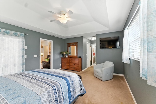 194 Sunset Rd, Rotonda West, FL 33947 - carpeted bedroom featuring a tray ceiling and ceiling fan