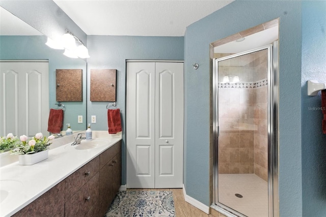 194 Sunset Rd, Rotonda West, FL 33947 - bathroom with double vanity and a stall shower