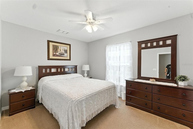 194 Sunset Rd, Rotonda West, FL 33947 - bedroom featuring light colored carpet and a ceiling fan
