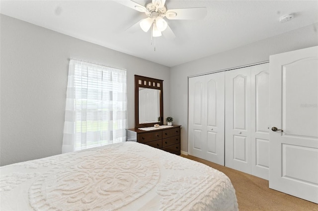 194 Sunset Rd, Rotonda West, FL 33947 - bedroom featuring light carpet, a closet, and ceiling fan