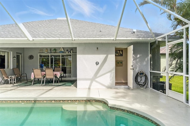 194 Sunset Rd, Rotonda West, FL 33947 - outdoor pool featuring a patio area and glass enclosure