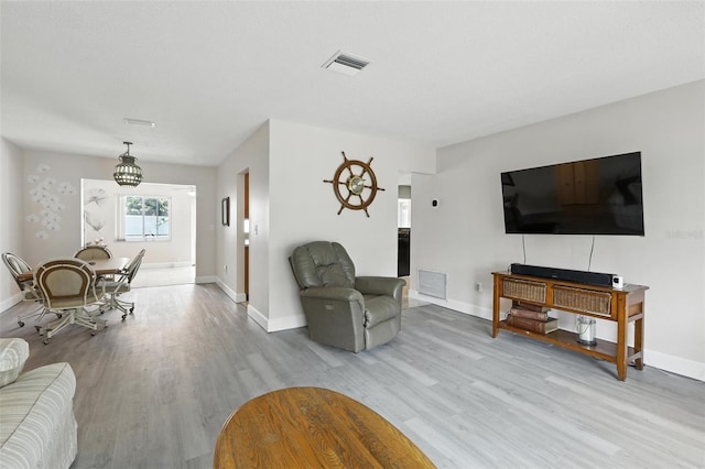 326 Mann Ave SE, Port Charlotte, FL 33952 - living room with wood finished floors and baseboards