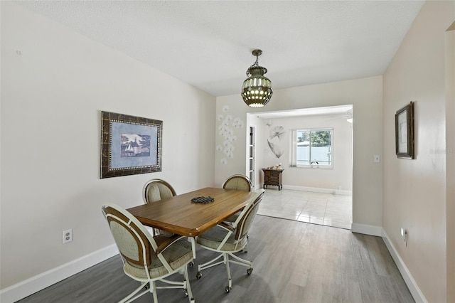 326 Mann Ave SE, Port Charlotte, FL 33952 - dining area featuring a chandelier and wood finished floors