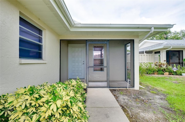 4339 Bowling Green Cir Unit 19, Sarasota, FL 34233 - doorway to property featuring stucco siding