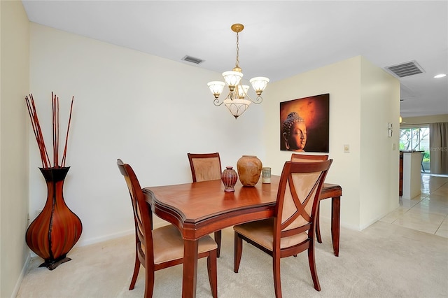 4339 Bowling Green Cir Unit 19, Sarasota, FL 34233 - dining room featuring a chandelier and light colored carpet